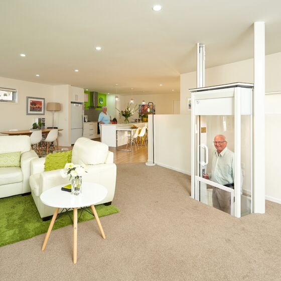 Mirage RESiLIFT residential lift man in lift halfway up lounge room
